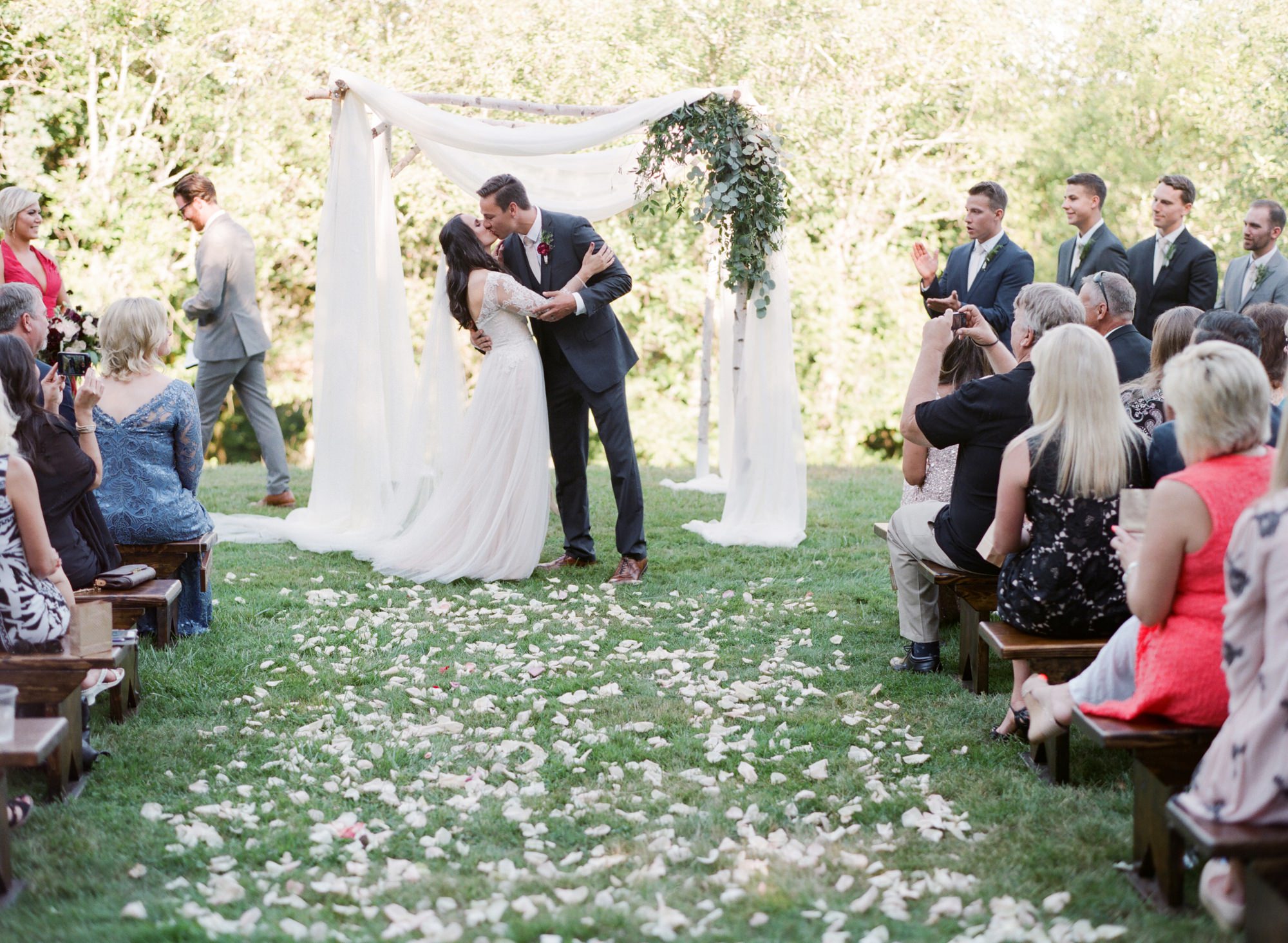 Washington wedding photographer film ceremony kiss